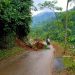 Warga saat melewati area longsoran di jalan Desa Rahtawu Kecamatan Gebog Kudus.